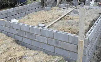 Professionals building a foundation with blocks in Overland Park, KS