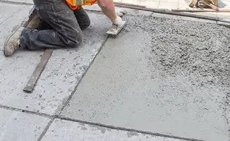Professional repairing a concrete floor in Overland Park, KS