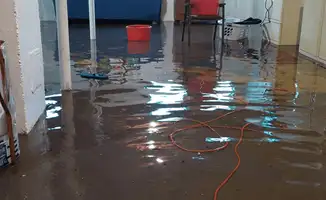 Basement with boiler, cabinets and washing machine completely flooded in Overland Park, KS