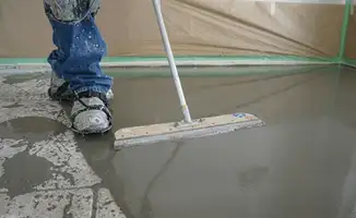 Uneven floor being professionally repaired in Overland Park, KS